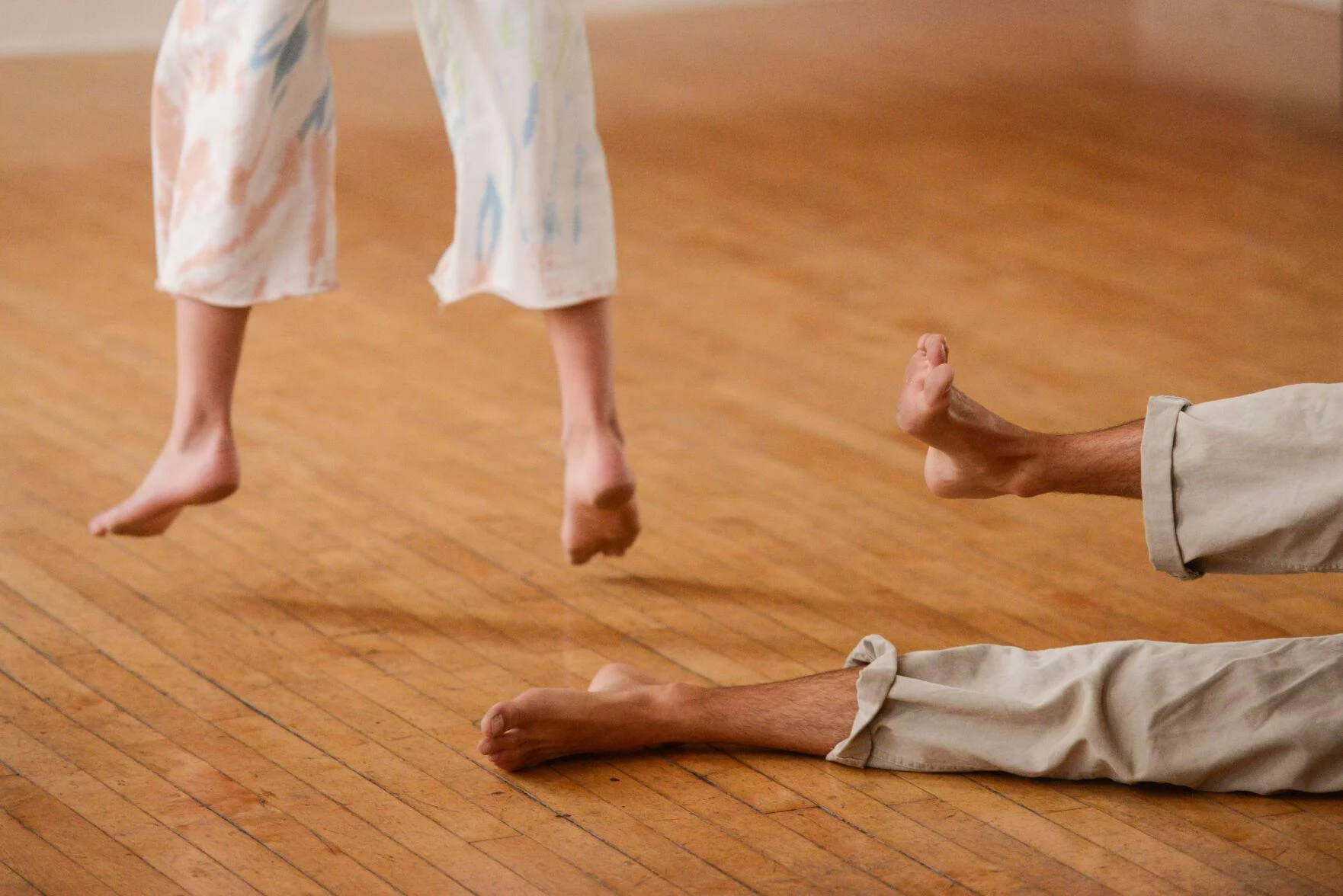 Connor and Isabel (© Rachel Leathe) A photo of the feet, during a dance movement, of the man and woman who make up Nervous Theatre.
